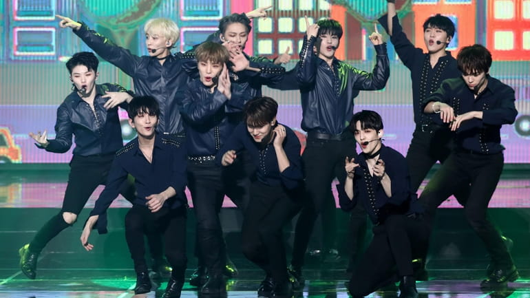 Boy band SEVENTEEN, which has 13 members (10 are pictured...