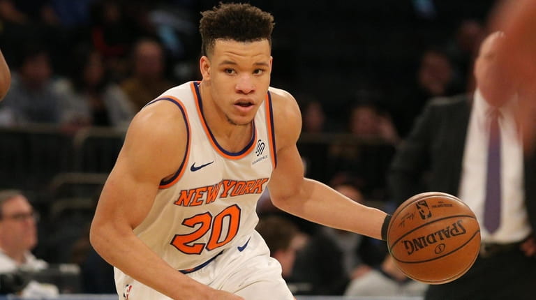 Knicks small forward Kevin Knox controls the ball against the...