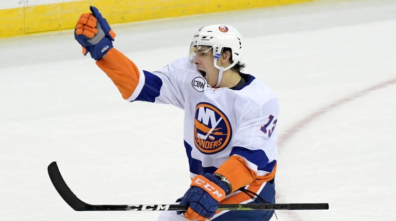 The Islanders' Mathew Barzal celebrates his game-winning goal in overtime against the Devils...