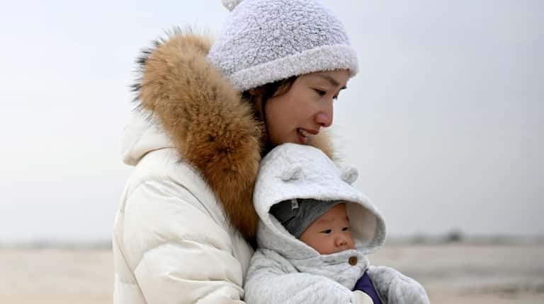Sarah Zhou and son George Gu, 4 months old, at...