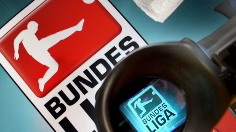 The logo of German Football League Bundesliga is seen through...
