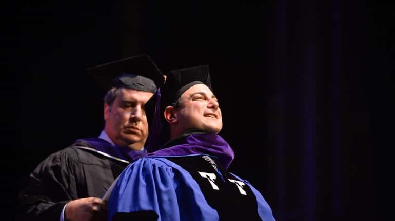 Graduate Martin Tankleff is hooded by his mentor Stephen L....