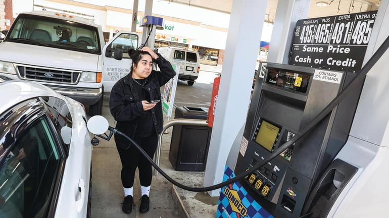 Georgina Rodriguez, of Brentwood, buys gas in Hauppauge earlier this month....