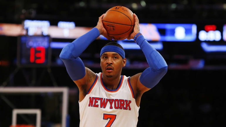 Carmelo Anthony #7 of the Knicks controls the ball in...