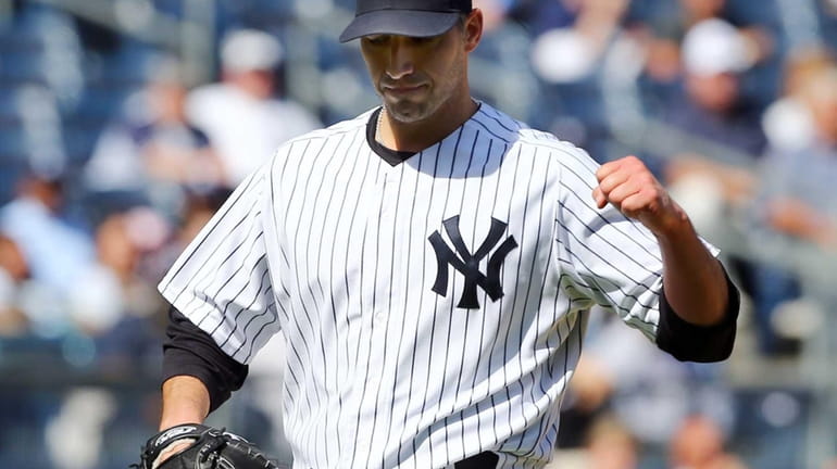 Andy Pettitte pumps his fist after a third-inning double play...