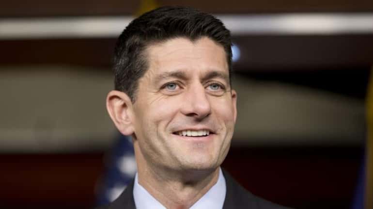 House Speaker Paul Ryan smiles during his news conference on...
