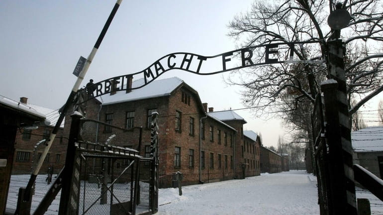The gate at the former Nazi death camp Auschwitz in...