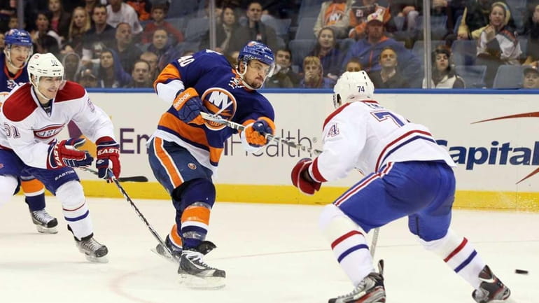 Michael Grabner #40 of the New York Islanders takes a...
