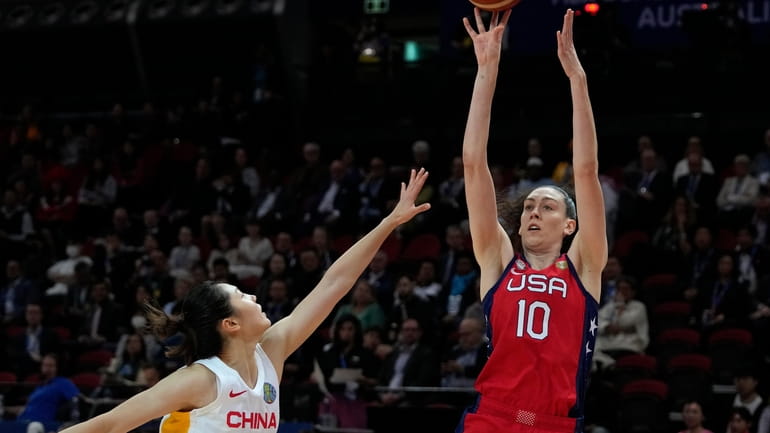 United States' Breanna Stewart, right, shoots over China's Zhang Ru...