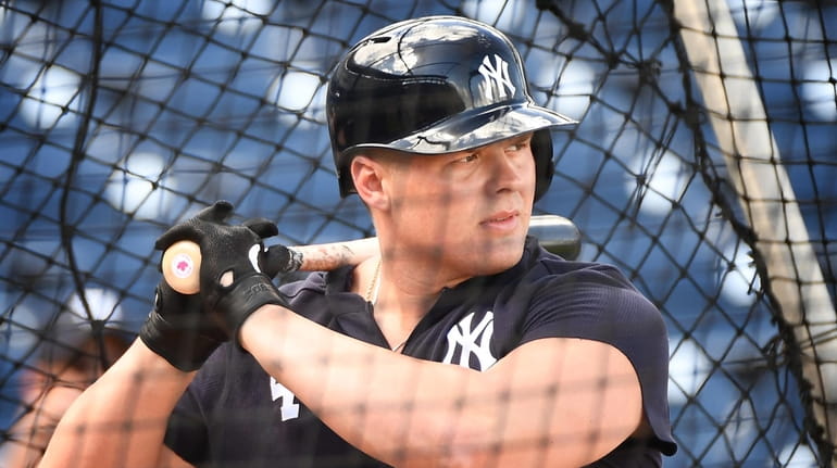 The Yankees' Luke Voit takes batting practice during spring training...