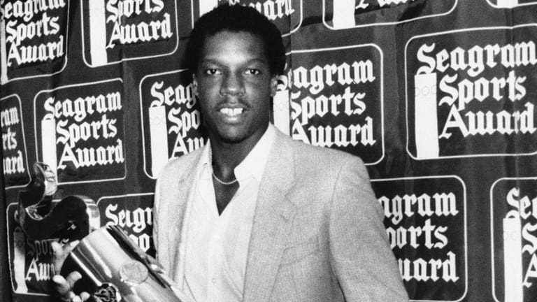 Mets pitcher Dwight Gooden holds his Seagram's Award Baseball Player...