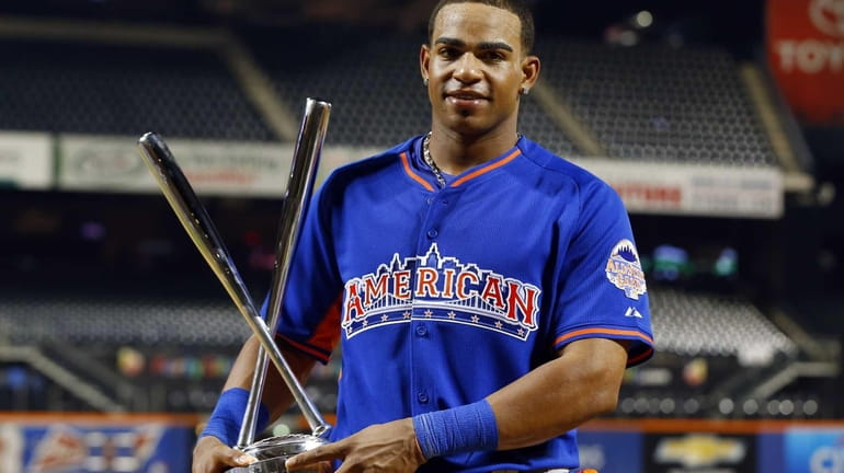 Yoenis Cespedes celebrates his Home Run Derby win with the...