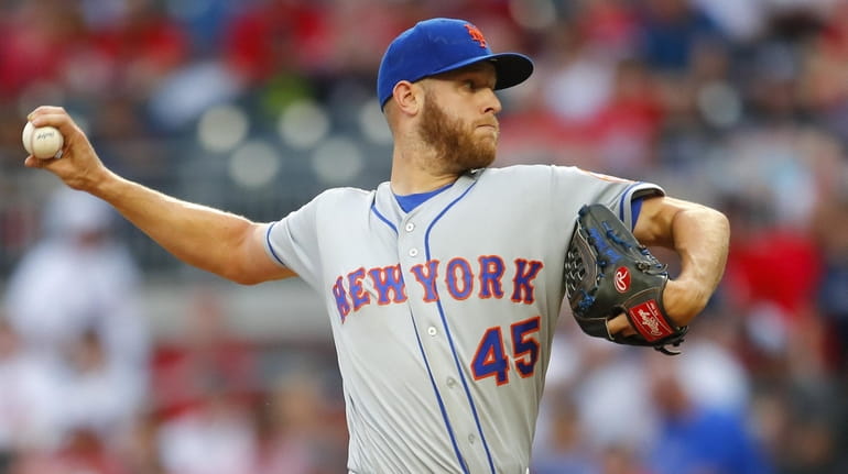 Zack Wheeler of the Mets delivers in the first inning...