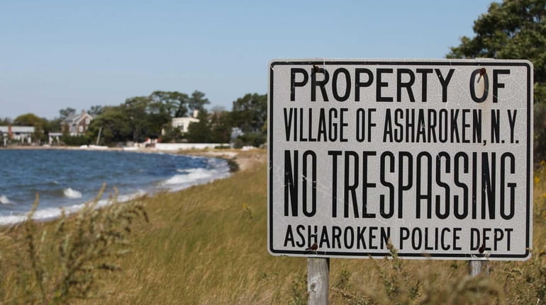 A no tresspassing sign is pictured at the border of...