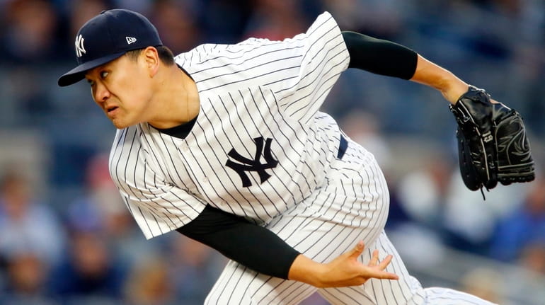 Masahiro Tanaka of the New York Yankees pitches in the...