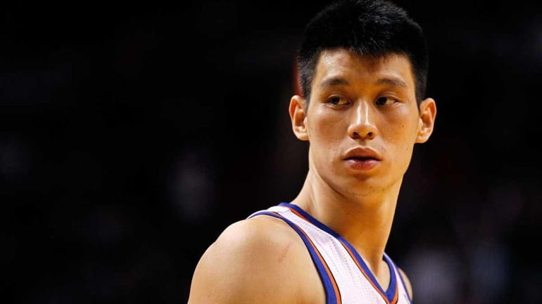Jeremy Lin of the New York Knicks looks on during...