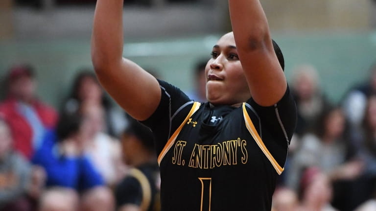 St. Anthony's Sydney Taylor shoots a free throw against Sacred...