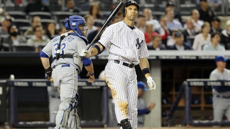 Raul Ibanez reacts after striking out with the bases loaded...