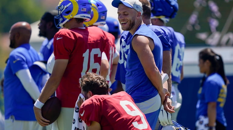 Los Angeles Rams wide receiver Cooper Kupp speaks with quarterback...