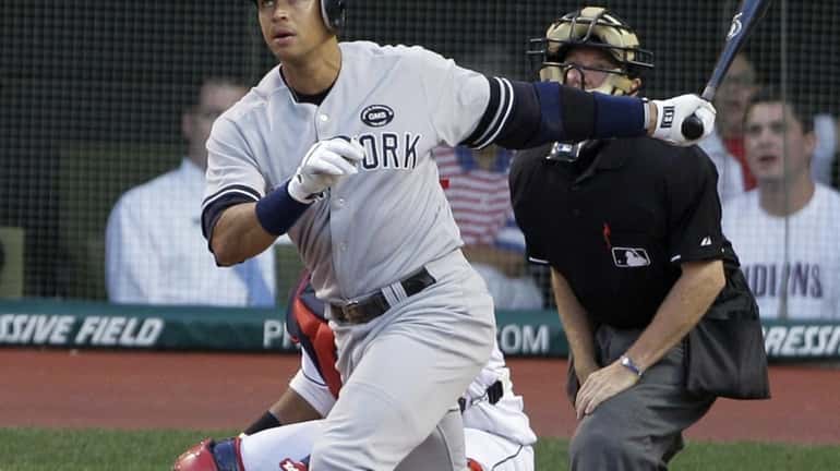 New York Yankees' Alex Rodriguez hits an RBI sacrifice fly...