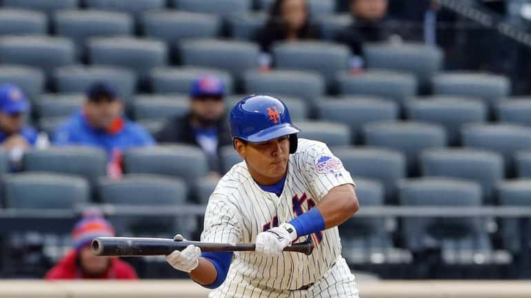 Ruben Tejada of the New York Mets pops up a...