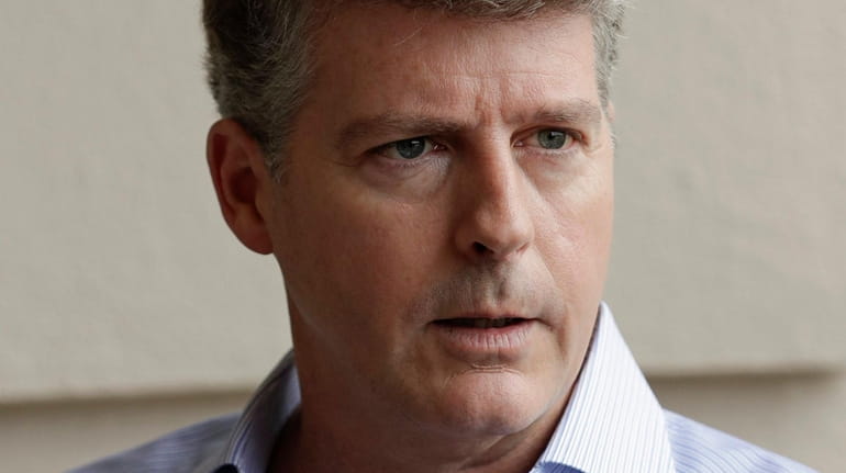Hal Steinbrenner, principal owner of the Yankees, talks with reporters during...