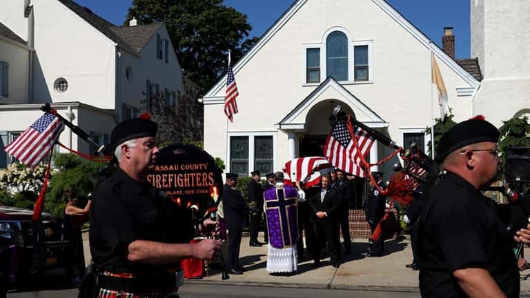 Funeral for Island Park firefighter Michael Fischer at Sacred Heart...