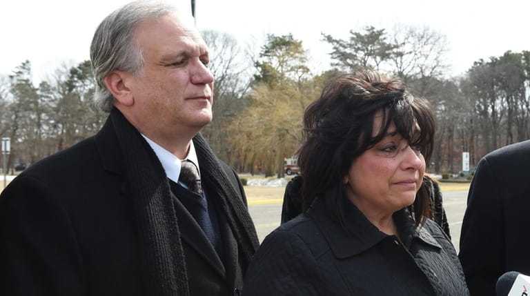 Edward and Linda Mangano leave federal court in Central Islip on March...