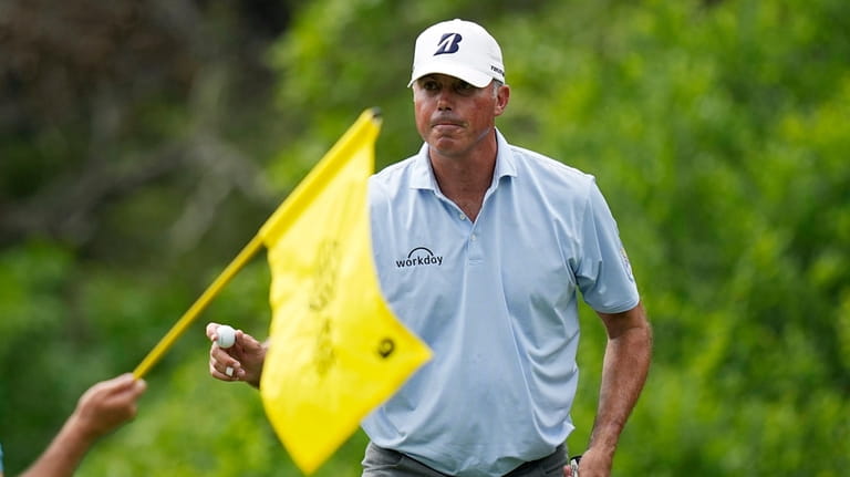 Matt Kuchar acknowledges the gallery after his putt on the...