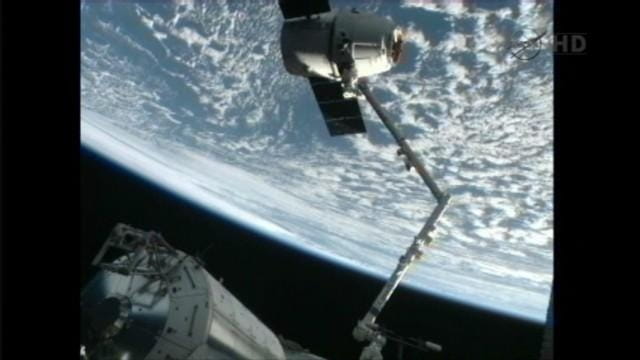 Early this morning, space station astronauts set the SpaceX capsule...