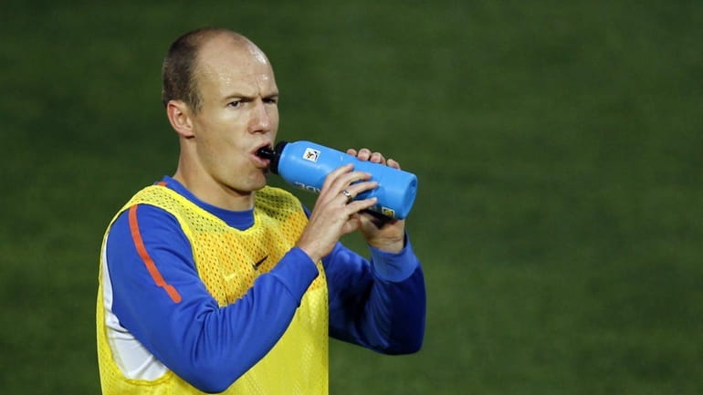Netherlands' striker Arjen Robben drinks during a training session at...