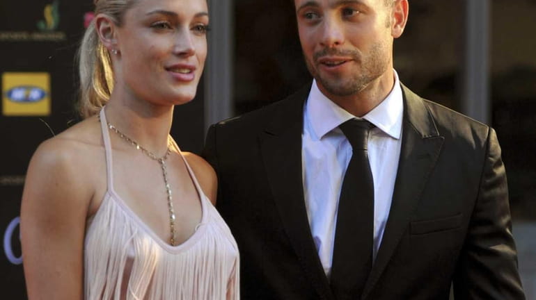 South African Olympic athlete Oscar Pistorius and girlfriend Reeva Steenkamp...