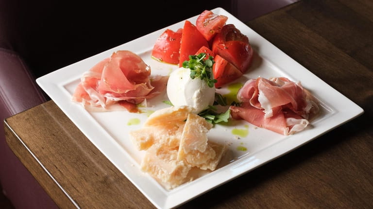 The M Bar platter with piles of prosciutto di parma,...