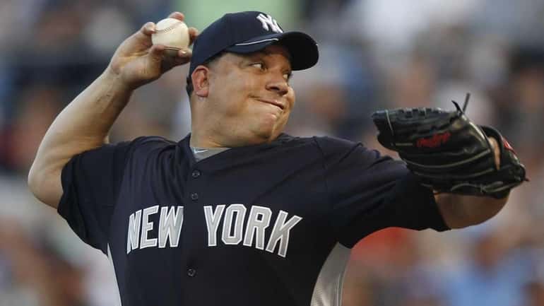 Yankees starter Bartolo Colon delivers to the plate during Monday's...