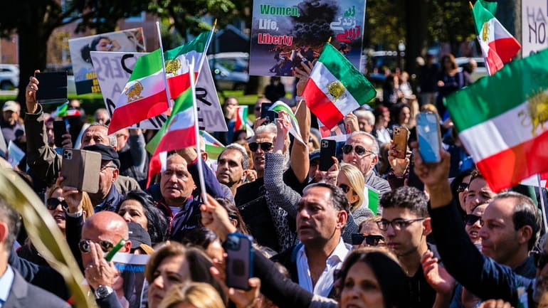 Iranian Americans and other supporters attend a unity rally at...