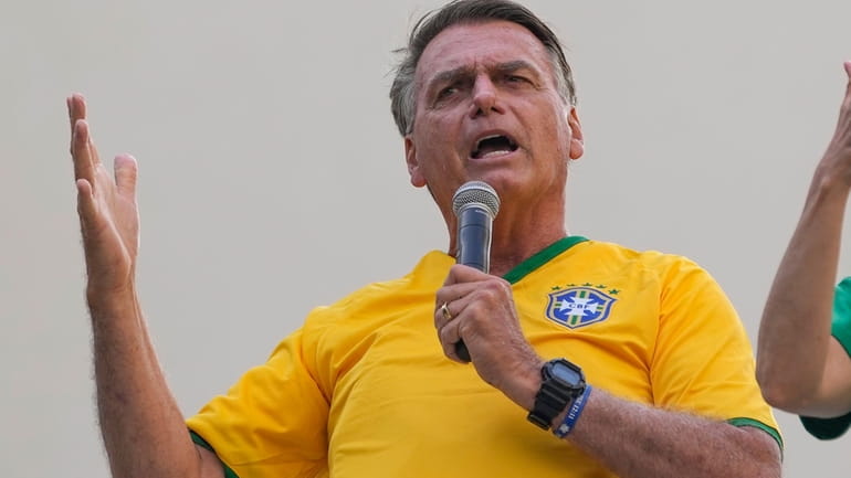 Former President Jair Bolsonaro addresses supporters during a rally in...