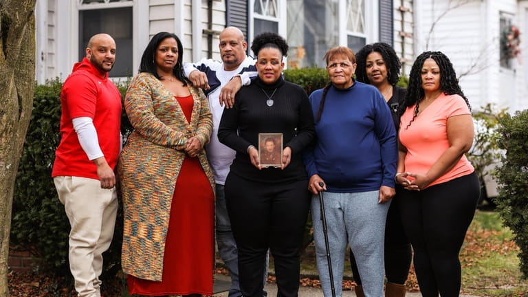 Arlenia Ferguson, third from right, is the widow of Wilfred...