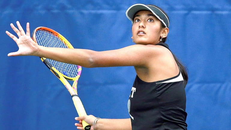 Division I Syosset’s first singles player Zia Mukherjee in game...