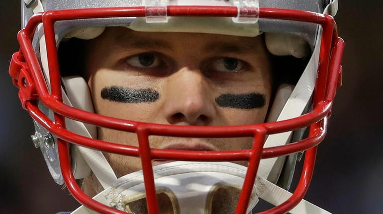 Patriots quarterback Tom Brady warms up before Super Bowl 52 against the...
