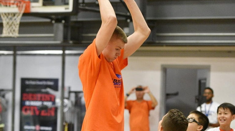 Kristaps Porzingis, forward for the NY Knicks playing with a...