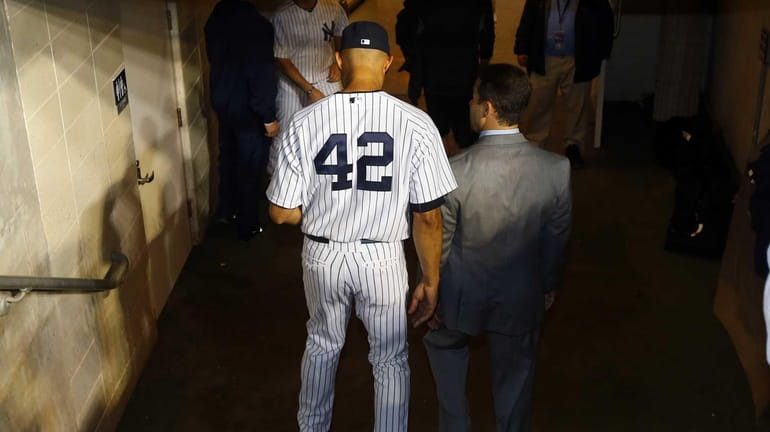 Mariano Rivera of the Yankees walks to the clubhouse after...
