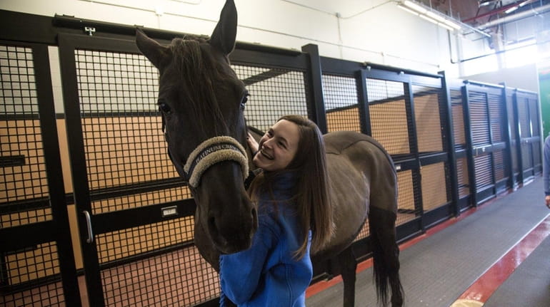 Kristen McGowan with Messina, a 7-year-old Hanoverian, a breed originating...