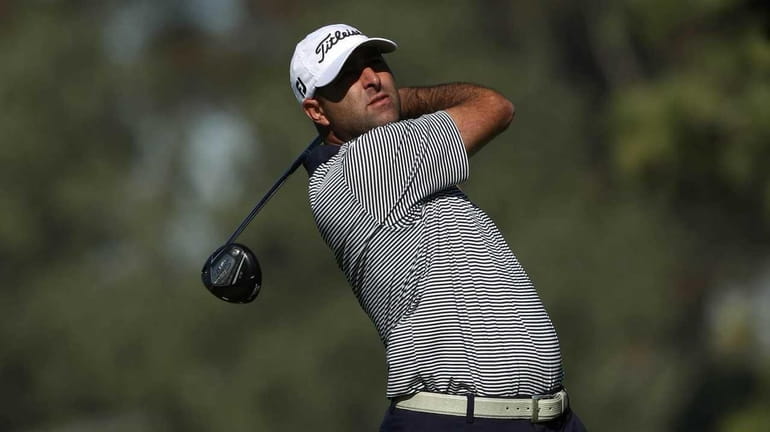 Marc Turnesa tees off the fifth hole during the first...