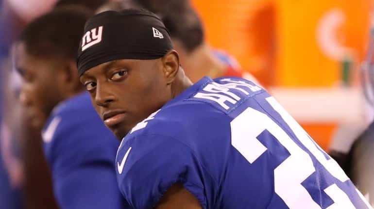 Giants cornerback Eli Apple sits on the bench during a...