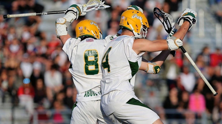 Ward Melville's Matthew Grillo and Zach Hobbes celebrate a goal...