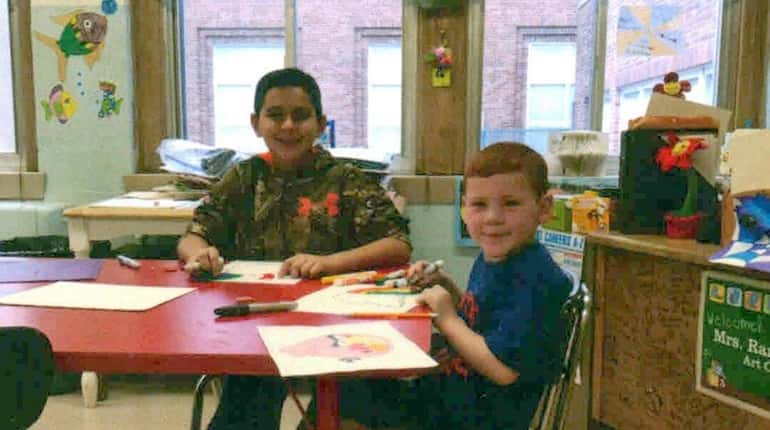 Kidsday reporter Joey Bruno, left, drawing with schoolmate Jack Foley...