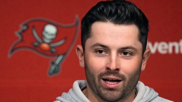New Tampa Bay Buccaneers quarterback Baker Mayfield answers a question...