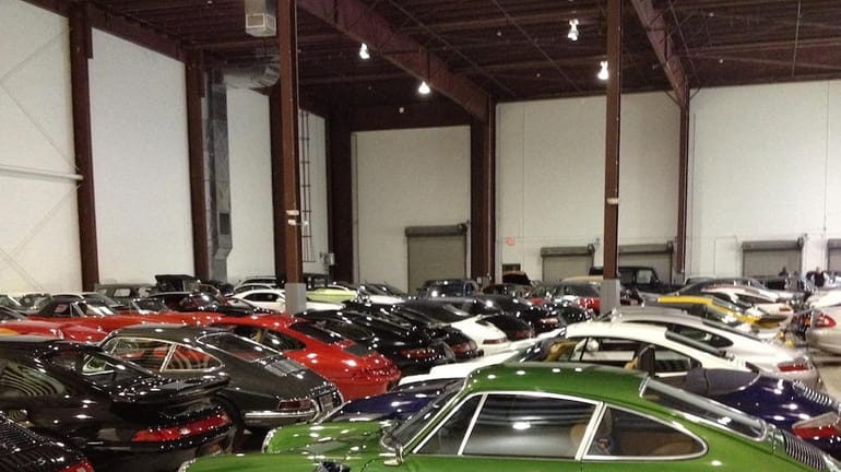 Rows of vintage automobiles sit on display at Exotic Classics...