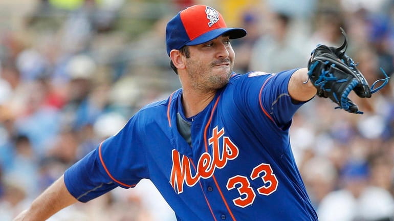 New York Mets' starting pitcher Matt Harvey delivers the ball...