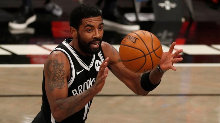 Kyrie Irving of the Nets controls the ball during the second...